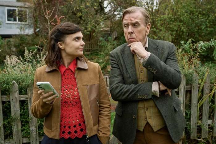 565707,TITLE: Death Valley S2 Gwyneth Keyworth as DS Janie Mallowan and Timothy Spall as John Chapel stood next to each other with intrigued looks on their faces.