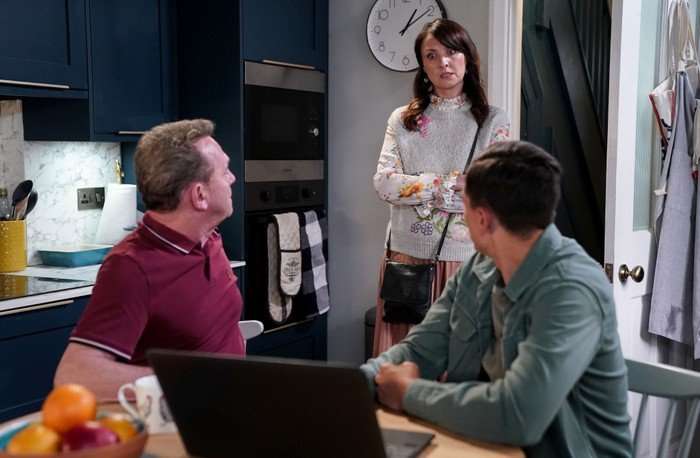 566237,TITLE:Eastenders Bea stands over Billy and Will in a scene from EastEnders