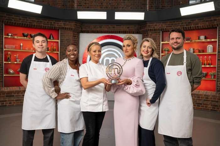 The MasterChef finalists with judges Anna Haugh, Grace Dent holding the trophy.