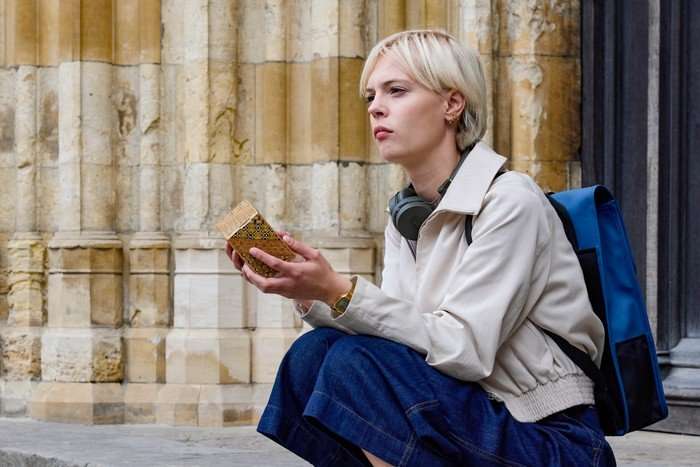 78256_1_S2_Ep1_- Embargo 0001 Tuesday 30th December - Patience Series 2 - Ep1 (2) Ella Maisy Purvis sat on church steps holding a puzzle box in a scene from Patience season 2