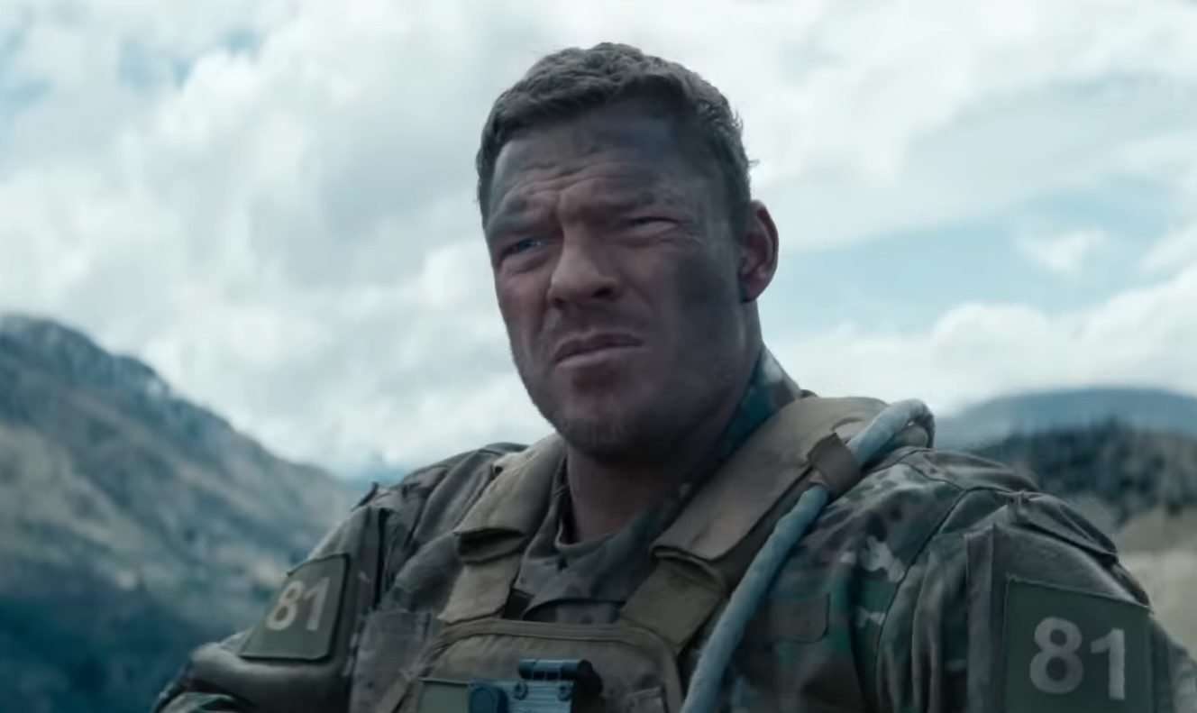 Alan Ritchson as Staff Sergeant 81 looking serious in the 2026 film, War Machine.