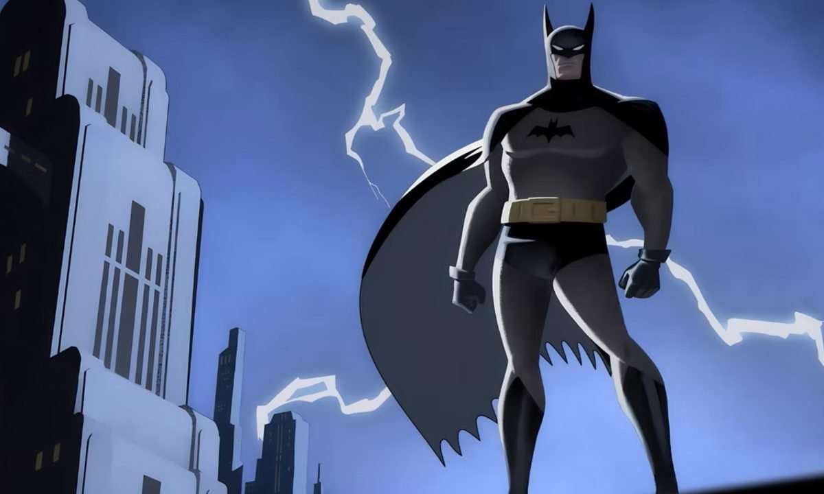 Batman stands on a Gotham rooftop as lightning strikes in the background.