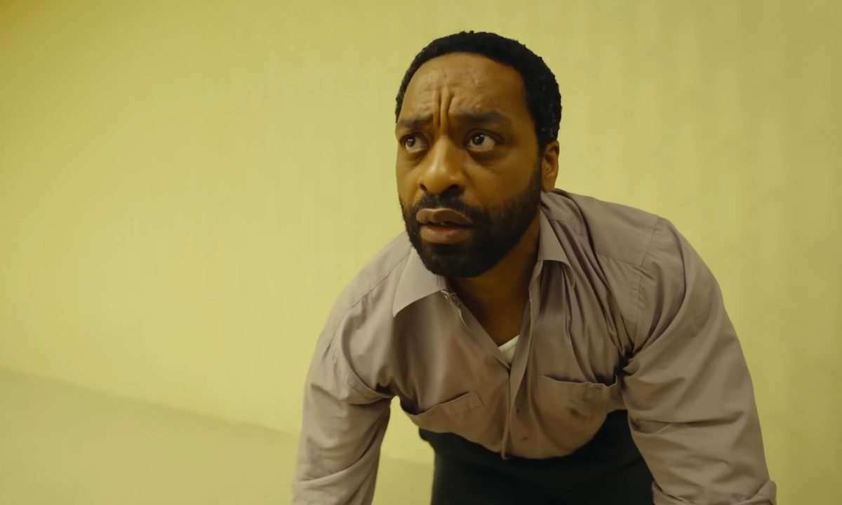 Chiwetel Ejiofor looking astonished in Backrooms, the horror film directed by Kane Parsons and produced by A24.