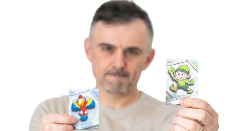 Gary Vee holding up two VeeFriends cards.
