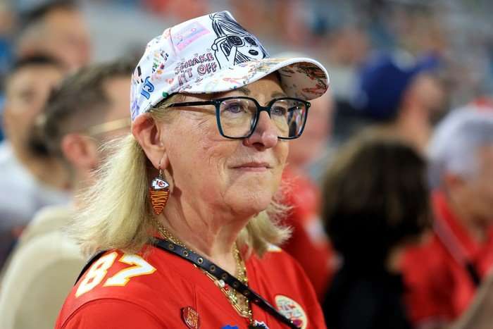 Kansas City Chiefs v Jacksonville Jaguars Donna Kelce wearing a football shirt and baseball cap, standing sidewards to the camera.