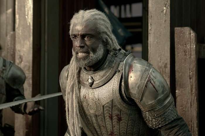 Steve Toussaint as Corlys Velaryon in House of the Dragon season 3 Steve Toussaint as Corlys Velaryon in House of the Dragon season 3, standing on a ship and looking worriedly out to sea.