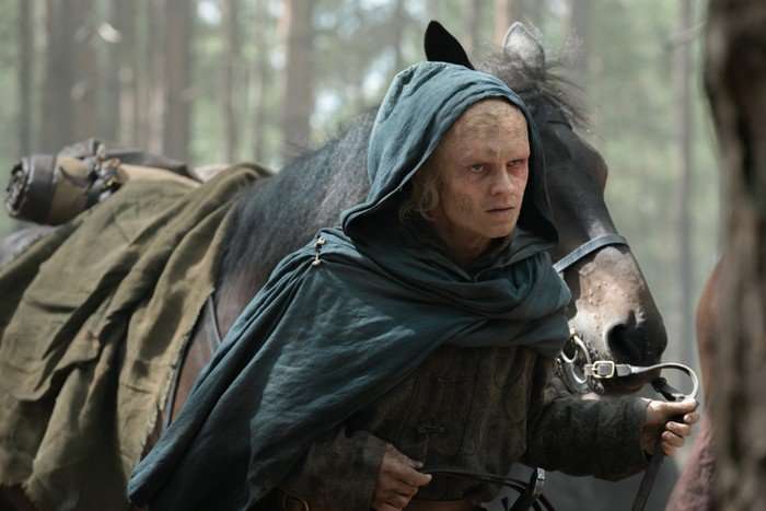 Tom Glynn Carney as Aegon Targaryen in House of the Dragon Tom Glynn Carney as Aegon Targaryen in House of the Dragon. His face is burned, and he's wearing a green cloak, leading a horse along a forest floor.