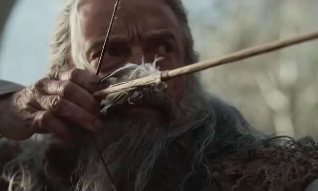 Hugh Jackman wielding a bow and arrow in the A24 film, The Death of Robin Hood.