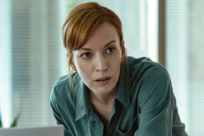 Britt Lower as Rachel Mills in I Will Find You. A woman looking shocked.