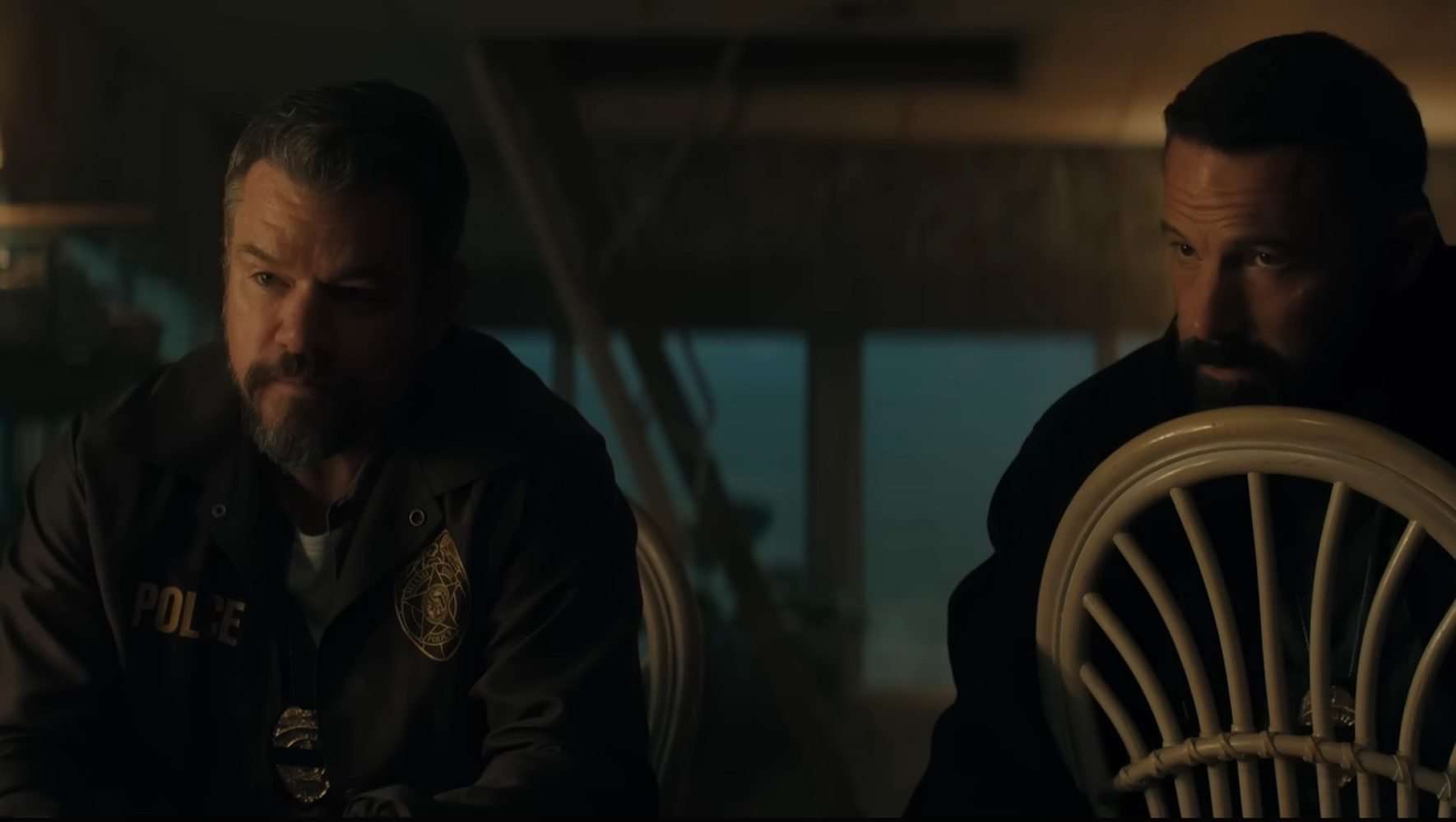 Matt Damon and Ben Affleck sitting down in The Rip.