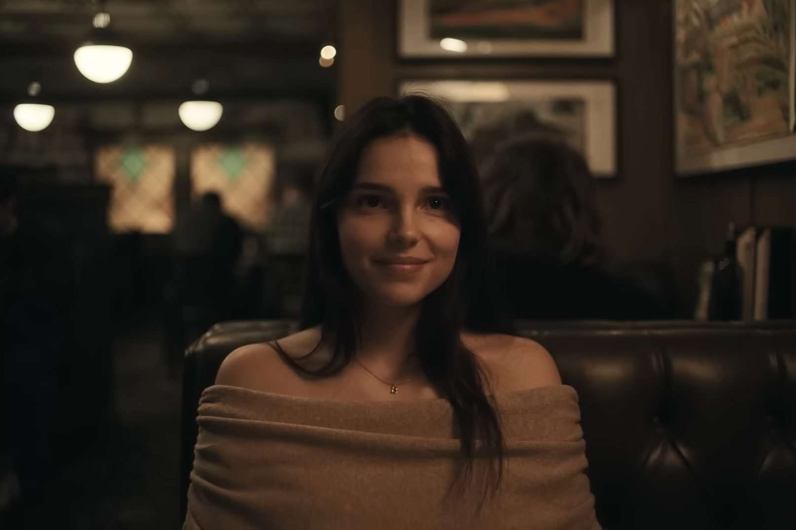 Nikki Freeman (Inde Navarrette) smiling in a diner in the horror film, Obsession.