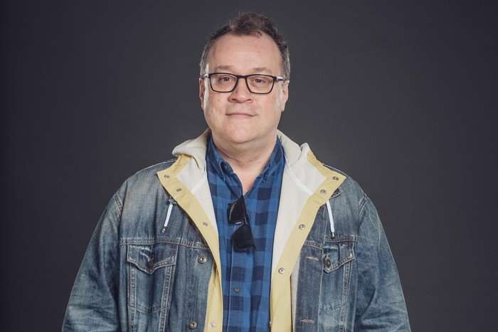 Russell T Davies Russell T Davies in a denim jacket and chequered shirt