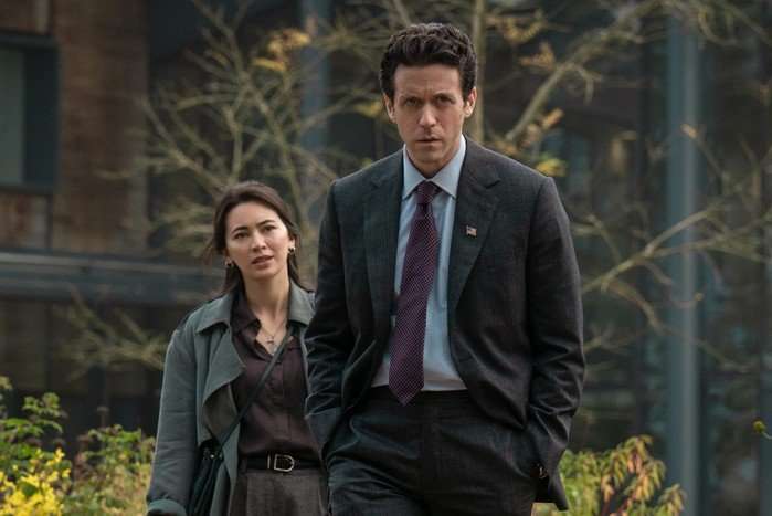 Ashley Zukerman as Daniel Keene and Jessica Henwick as Helen Drew in Silo season 3. The pair are pictured in a garden and Daniel is walking away from Helen.