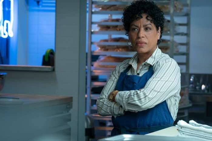 Liza Col&oacute;n-Zayas as Tina in The Bear, with her arms crossed
