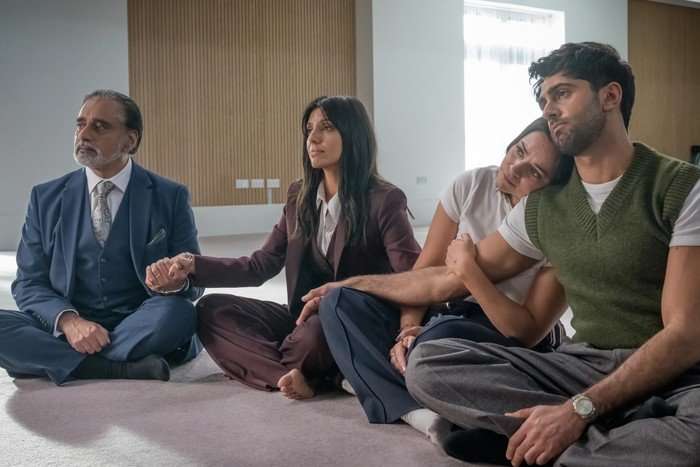 Sanjeev Bhaskar, Ritu Arya, Aysha Kala and Arian Nik in The Split Up. The Kishan family, Sanjeev Bhaskar, Ritu Arya, Aysha Kala and Arian Nik, sat holding hands on the floor in The Split Up.