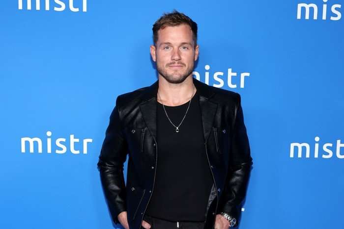 the-traitors-US-colton-underwood Colton Underwood looking ahead whilst wearing all black and standing with his hands in his pockets.
