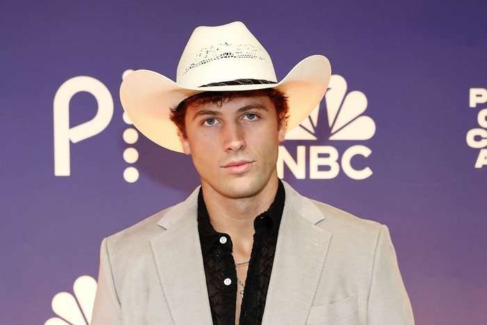the-traitors-US Rob Rausch wearing a cowboy hat and looking ahead.