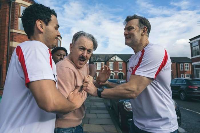 alan-cumming-david-morrissey-tip-toe-ending A man restrains Leo, while Clive grabs him and mutters something spitefully in this scene from the Tip Toe finale