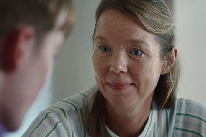 heartstopper-forever-anna-maxwell-martin A close-up shot of Sarah smiling at her son, Nick, in a scene from Heartstopper Forever