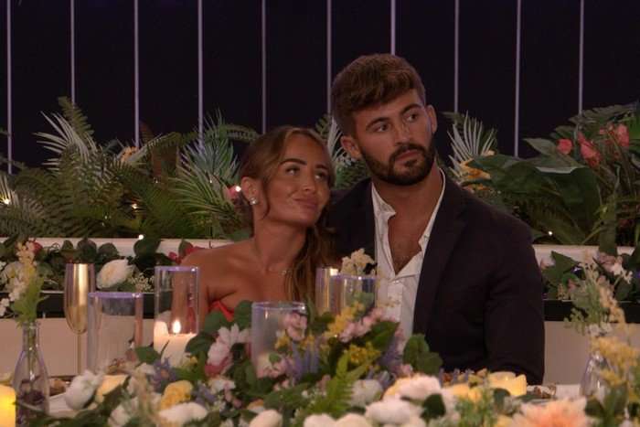 love-island-nicole-ciaran Nicole and Ciaran sat next to each other, both looking upwards.