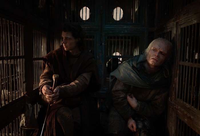 CORLYS - ARMOUR LOOK Matthew Needham as Lord Larys Strong and Tom Glynn-Carney as King Aegon II Targaryen in a carriage in House of the Dragon.