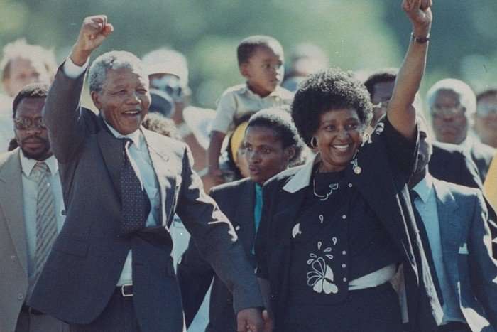Nelson Mandela and wife Winnie Nelson Mandela and wife Winnie, walking with their fists in the air in triumph in front of a crowd of followers.