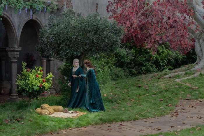 Olivia Cooke as Alicent Hightower and Phia Saban as Helaena Targaryen stand in the Godswood in House of the Dragon season 3.