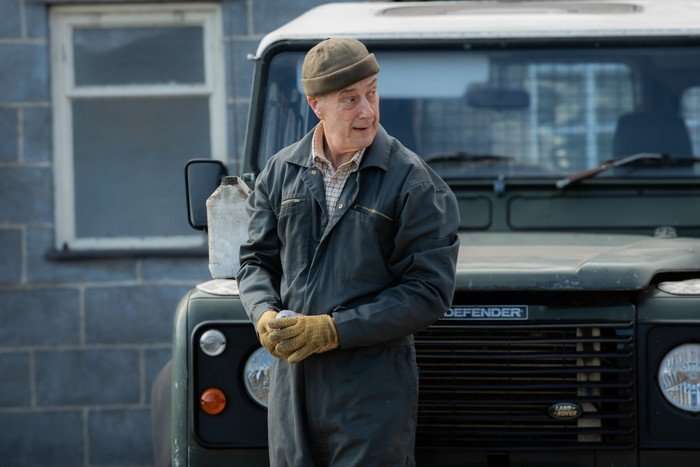 The Fortune Stephen Tompkinson as Boots Maddison in The Fortune standing by a jeep, cleaning his gloves and wearing a mechanic's uniform.