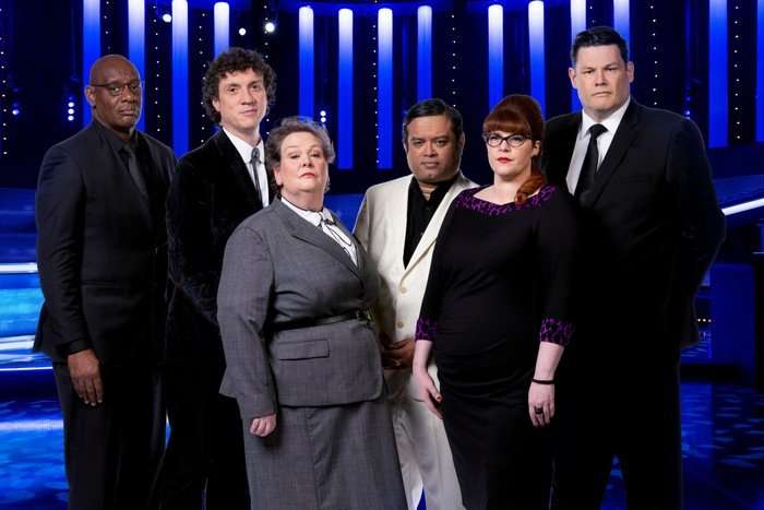 the_chase_generic_02 The Chasers all stood in a row in The Chase studio looking ahead with serious expressions.