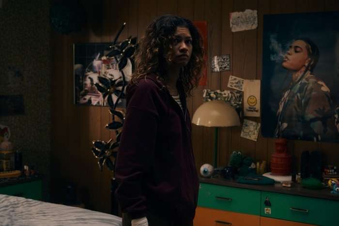 Zendaya as Rue Bennett standing in her bedroom in Euphoria season 3.