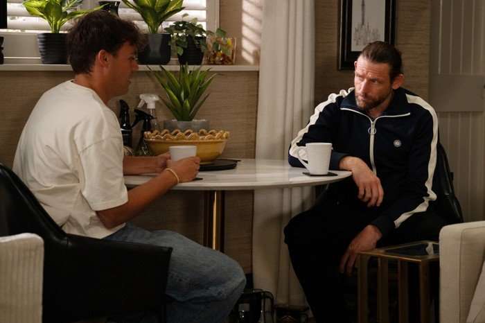 08_07_emm_lewis_kev_01 Lewis and Kev have a chat around a circular dining table in a scene from Emmerdale
