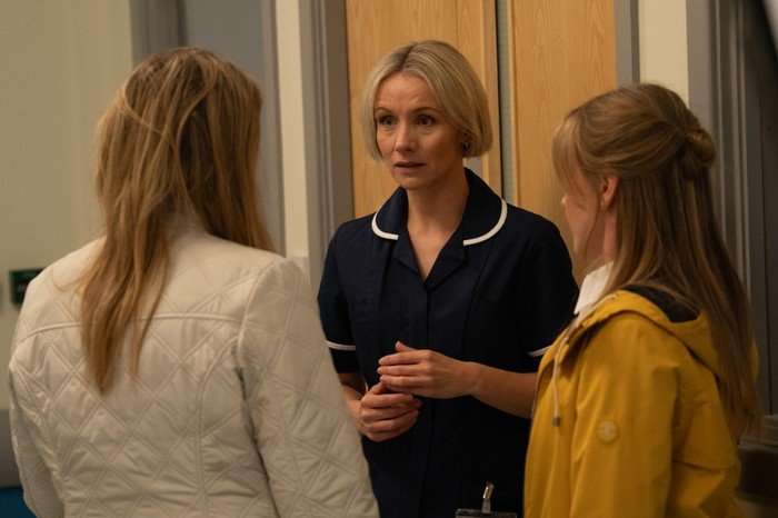 21_07_emm_charity_vanessa_02 Vaness and Charity talk to Helen in a hospital corridor in Emmerdale