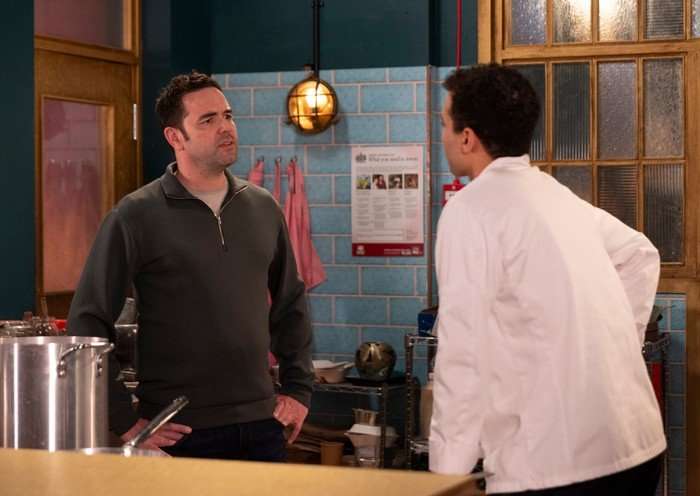26_07_coro_ben_ollie_01 Ben and Ollie have a chat in the Speed Daal kitchen in Coronation Street