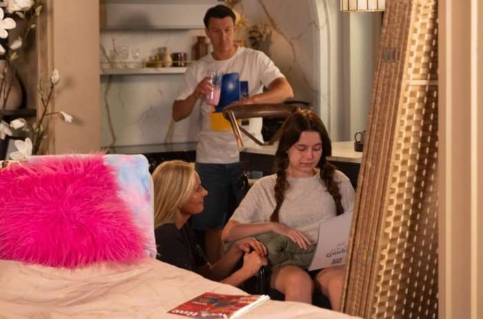 31_07_coro_betsy_home_02 Ryan and Lisa assist Betsy in a scene from Coronation Street