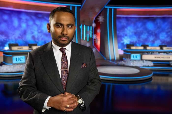 545234,TITLE:Christmas University Challenge 2025 Amol Rajan wearing a suit and looking ahead with his hands held together.