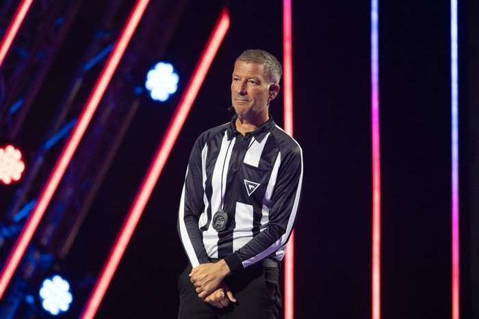 548997,TITLE:Gladiators series 3 Mark Clattenberg stands in a jersey on the set of Gladiators.