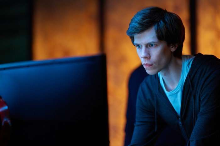 The Undeclared War - Series 2 Ep2 German Segal as Vadim Trusov in The Undeclared War, looking at a computer screen in a dark room.