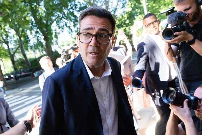 Andy Burnham. Andy Burnham speaking to reporters.