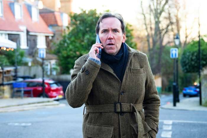 Austin Ben Miller as Julian, standing in the street, talking on the phone