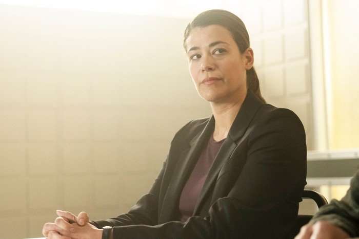 Celine Arden as Kara Molloy sat in an interview room