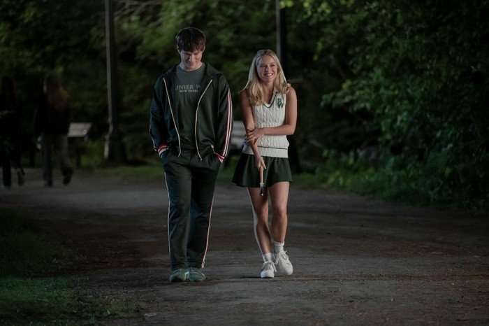 Jacob Moskovitz as Miles and Lexi Minetree as Elle Woods in Elle, walking down a street together at night.