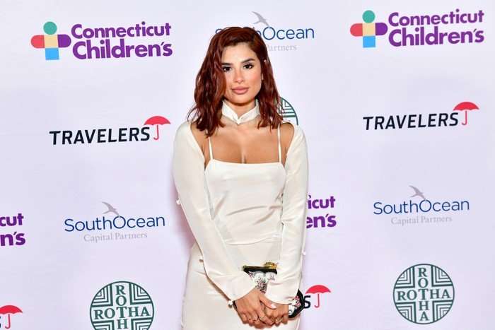 Connecticut Children's Annual Gala Diane Guerrero poses in a white dress on the red carpet at the Connecticut Children's Annual Gala