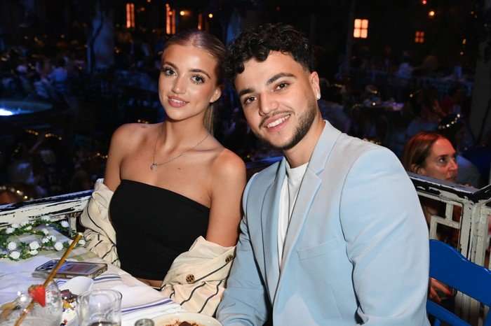 "Mamma Mia! The Party" Gala Night Princess and Junior Andre sat down next to each other smiling ahead as they pose for a photo.