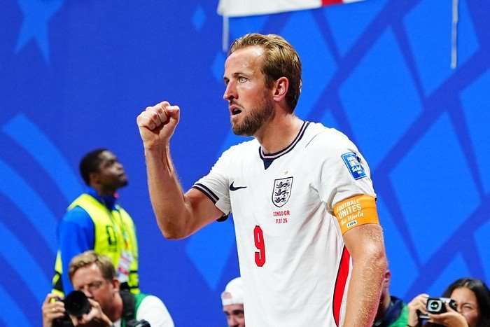 World Cup top scorers Kane England striker Harry Kane, in white and red football kit, holds up his fist as he celebrates scoring at World Cup 2026.