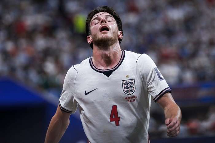 World Cup 2026 out England midfielder Declan Rice, in white football kit, looks dejected on the pitch at World Cup 2026.