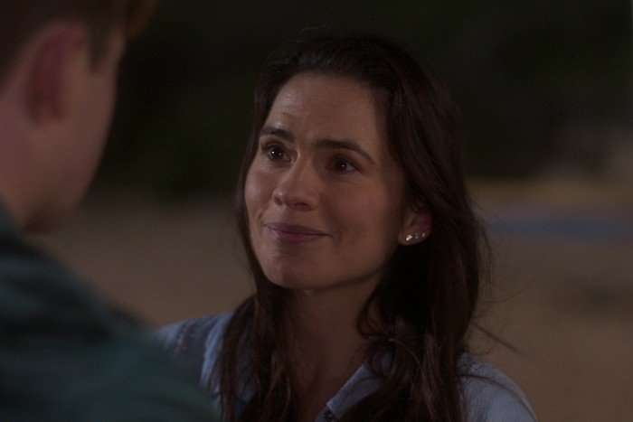 Hayley Atwell as Diane in Heartstopper season 3 speaking to Kit Connor and looking sympathetic.