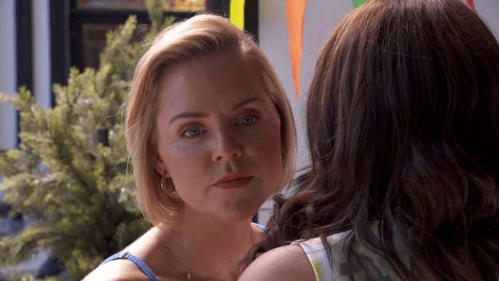 Cindy looks alarmed around Beth in a scene from Hollyoaks