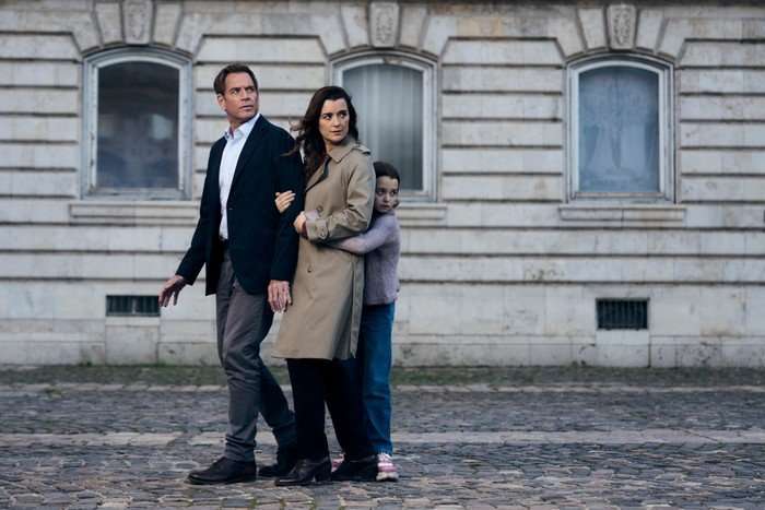NCIS: Tony & Ziva Michael Weatherly as Tony Dinozzo, Cote de Pablo as Ziva David and Isla Gie as Tali in NCIS: Tony & Ziva, walking down the street together.