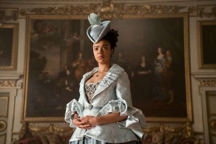 India Amarteifio in Queen Charlotte: A Bridgerton Story wearing a regal blue dress