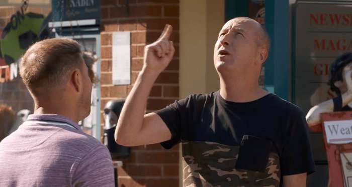 Kirk points up at the sky in a scene from Coronation Street